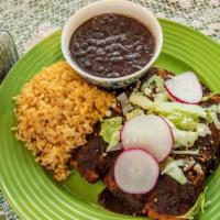 Enchiladas De Mole (3) · Your choice of cheese or chicken wrapped in corn tortillas topped with a classic Mexican mol...