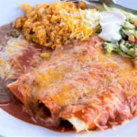 Enchiladas Rojas · Chicken or beef. Smothered in our special red sauce with cheese on top. Served with rice and...