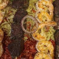 Mixed Grill · One skewer each of lamb, beef, chicken and shrimp served with rice and salad