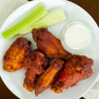 Buffalo Wings Served With Ranch & Celery Sticks · 