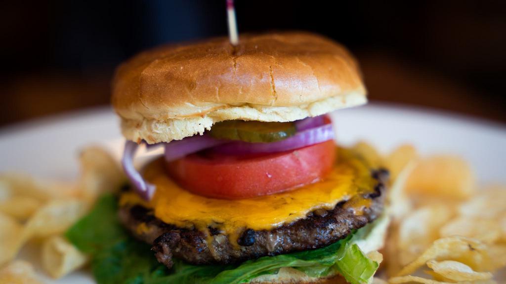 Cheeseburger · 6 ounce  beef patty, cheddar, lettuce, red onions, tomatoes, pickles and mayo in brioche bun