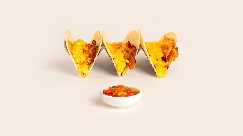 Breakfast Cheese Taco · A breakfast taco but with even more cheese. Scrambled eggs, salsa, and your choice of protein on a cheese filled taco tortilla.