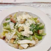 Caesar Salad · Romaine lettuce, croutons with a tangy Caesar dressing, topped with Romano cheese.