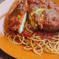 Chicken Parmigiana · House made herbed marinara sauce, pasta, cheese, and chicken breast.