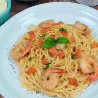 Shrimp Scampi · Sauteed shrimp in a scampi butter, white wine and garlic sauce with diced tomatoes served ov...