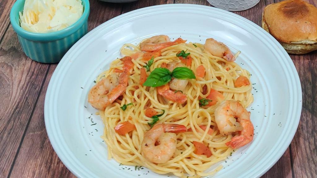 Shrimp Scampi · Sauteed shrimp in a scampi butter, white wine and garlic sauce with diced tomatoes served over spaghetti.