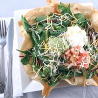 Tostada Salad · Spring mix, refried beans, your choice of shredded chicken, picadillo beef or barbacoa. Serv...