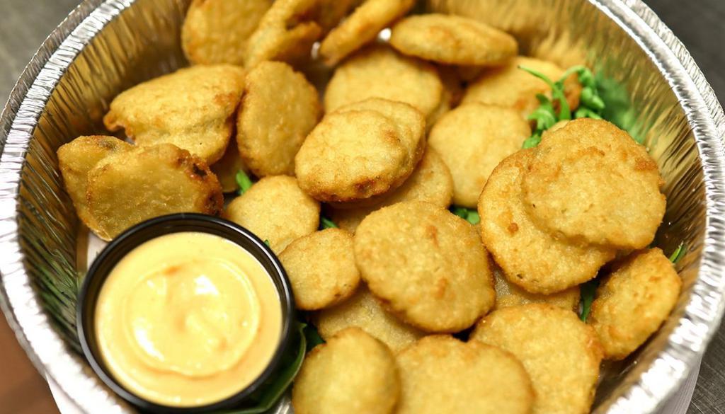 Beer Battered Pickles · Fried pickle chips served with house-made sriracha aioli