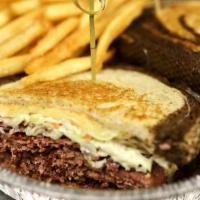 Reuben · Corned beef, Swiss cheese, house-made Napa slaw and Thousand Island Dressing on toasted marb...