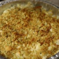 Cast Iron Mac · Five cheese baked elbow macaroni and cheese, topped with Ritz cracker crumbs