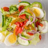 Garden Salad · A generous portion of fresh letters, tomatoes, carrots, cucumbers, red onions, and black oli...