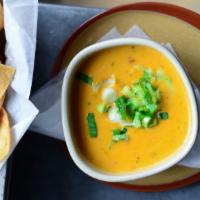 Chili Con Queso · Warm cheese dip with chilis, tomatoes, and  love