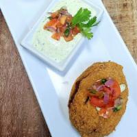 Fried Avocado · Whole Fried Hass Avocado Stuffed with Chorizo, Pepper Jack Cheese, Rice and Roasted 
Red Pep...