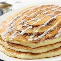 Sin A Bonn Pancakes · Our own buttermilk pancakes with a cinnamon bun swirl and topped with a cinnamon bun frosting!