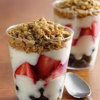 Yogurt Bowl · Low fat vanilla yogurt with fresh strawberries and blueberries, topped with granola.