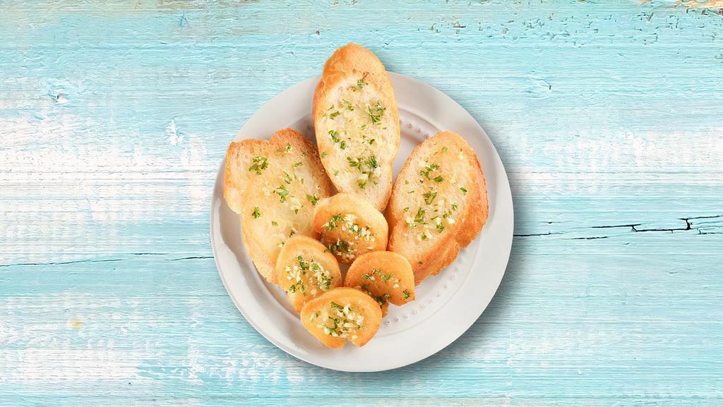 Garlic Bread Galore · Our spin on the traditional garlic bread consists of fresh garlic and butter. It can be enjoyed with or without cheese depending on your preference.