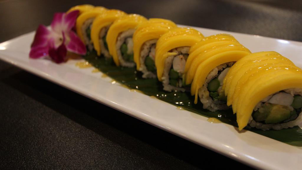 Hawaii · Shrimp, asparagus, cucumber, and avocado inside topped with mango with sweet mango sauce.
