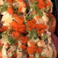 Sansom Roll · Shrimp tempura, crab stick and avocado roll, topped with tuna, salmon, avocado, eel sauce, s...