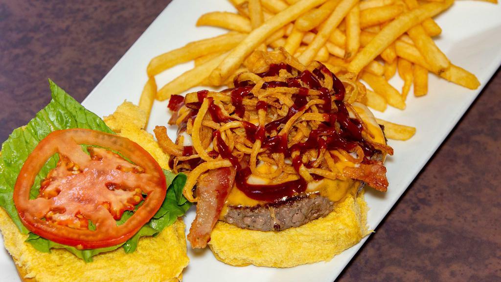 Hickory Burger · Cheddar, Monterey jack cheese, bacon, BBQ sauce, and crispy fried onion straws. Served with fries.