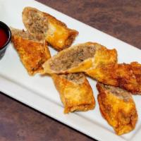 Cheesesteak Eggrolls · Sliced ribeye, caramelized onions, American cheese, and tabasco infused ketchup.