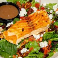 Grilled Salmon Salad · Spring mix, grilled salmon, candied pecans, diced tomatoes, goat cheese, and balsamic vinaig...