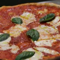 The Margherita · Fresh tomatoes, a dash of our homemade sauce, fresh mozzarella, full-leaf basil and extra vi...