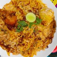 Awadhi Chicken Biryani · Succulent chunks of chicken cooked with our signature biryani masala gravy and long grain pr...