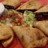 Philly Rolls · Carne Asada, onions, peppers, mushrooms and mixed cheeses rolled in egg roll wrap. Served wi...