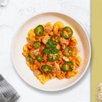 Hot Chick Mac · Spicy roasted chicken, chipotle cheese sauce, and jalapenos cooked in a blend of creamy chee...