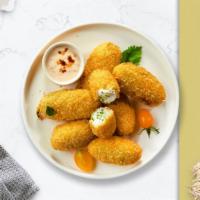 Happy Jalapeño Poppers · Fresh jalapeños coated in cream cheese and fried until golden brown.