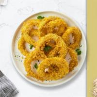 Onion Smash Rings · Sliced onions dipped in a light batter and fried until crispy and golden brown.
