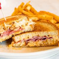 Reuben Melt · Corned beef, sauerkraut, swiss cheese and russian dressing, served on grilled rye bread.