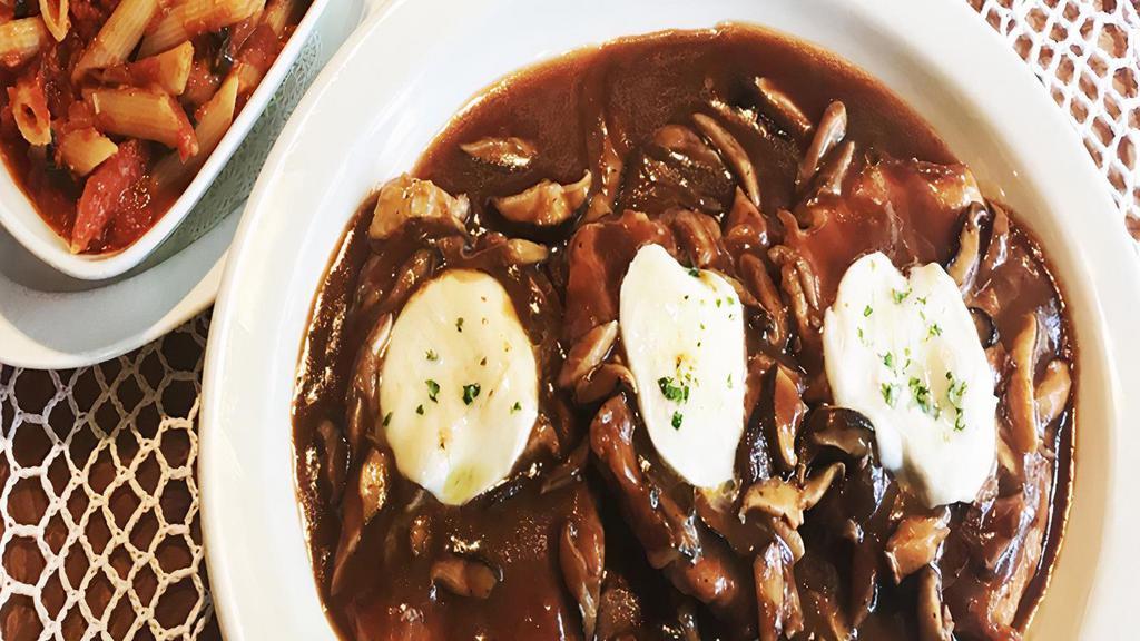 Chicken Alla Marsala · Scaloppini of bell & Evans chicken breast, pan seared with a rich sauce of shallots, porcini shiitake mushrooms and a glorious marsala wine reduction. Topped with fresh mozzarella cheese. Served with penne pasta with Sunday tomato sauce.