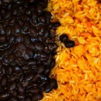 Yellow Rice And Beans · We cook rice using caramelized onion, and a hint of tomato brings fond memories of 