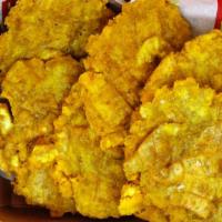 Crispy Tostones (Plantains) · Crispy fried green plantains dusted with sea-salt