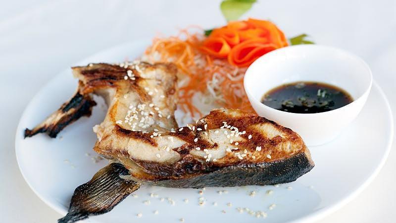 Hamachi Kama · Grilled yellowtail collar. Delicated fatty and super flavorful.