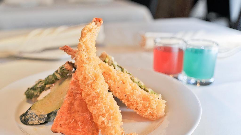 Shrimp Tempura Maki (8) · Shrimp tempura, avocado, cucumber and tobiko.