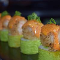 Celtics Maki (8) · Shrimp tempura, avocado, baked salmon salad, in green soybean paper, with spicy tobiko mayo.