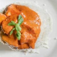 Chicken Tikka Masala · Spicy. Boneless chicken cooked in tandoor and mixed with rich, creamy tomato gravy. Served w...