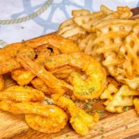 Fried Shrimp Basket · 8pc Colossal Jumbo Shrimp, lightly battered and fried until golden. Served with fries or yel...