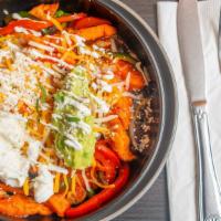 Fajita Bowl · Vegetarian. Gluten-free. Lettuce, Mexican rice, black beans, sautéed onions, and poblano pep...