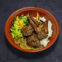Bbq Beef · Korean BBQ beef short ribs served with white rice, japchae noodle, and mix green salad.