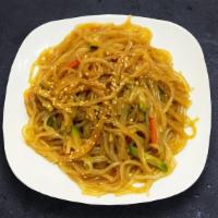 Classic Japchae · Vermicelli noodle stir-fried with beef, onion, carrot, mushroom, green onion, zucchini.