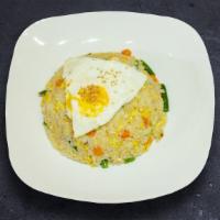 Frenzy Fried Rice · Mix vegetables sautéed with white rice and special seasoning, and egg on top.