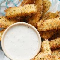 Mozzarella Sticks · Beer battered mozzarella sticks served with marinara sauce