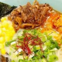 Spicy Tonkotsu Ramen · Spicy. Roasted chashu pork belly, fish cake, half cooked egg, bamboo shoots, com, green onio...