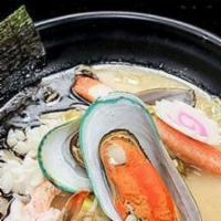 Seafood Ramen · Shrimps, mussels, scallop, kani, fish cake, bean sprouts, corn, and black garlic oil in miso...