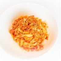 Tagliatelle Alla Bolognese · Thin, ribbon-shaped housemade pasta, beef & pork ragù, Mutti tomato sauce, Parmigiano Reggia...
