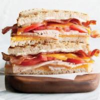 Club · oven-roasted turkey, bacon, cheddar, tomato, mayonnaise, grilled sourdough