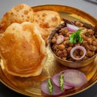 Chole Bhature · Chickpeas curry served with two bhatura/puri.